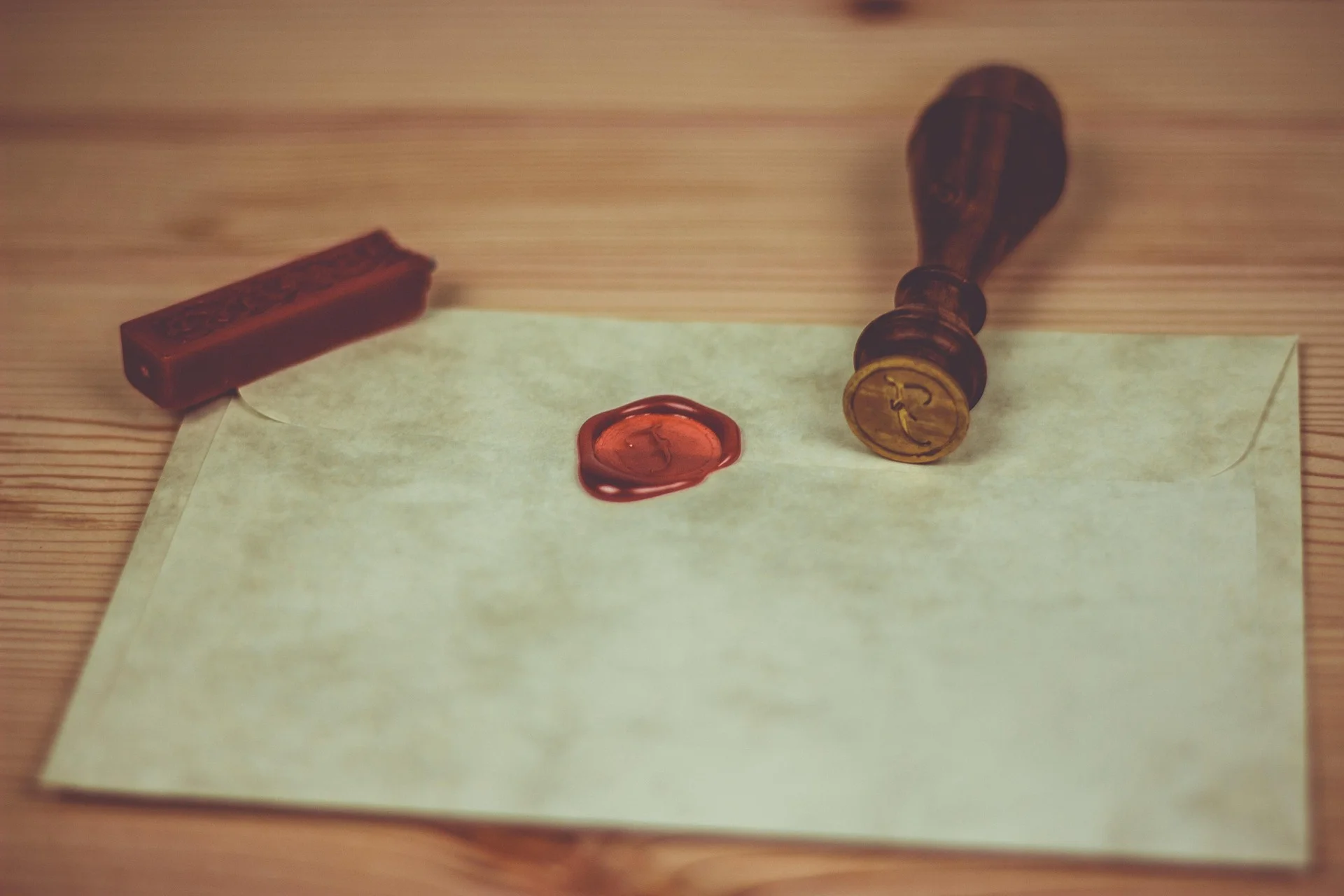 vintage-looking photograph with envelope and wax seal