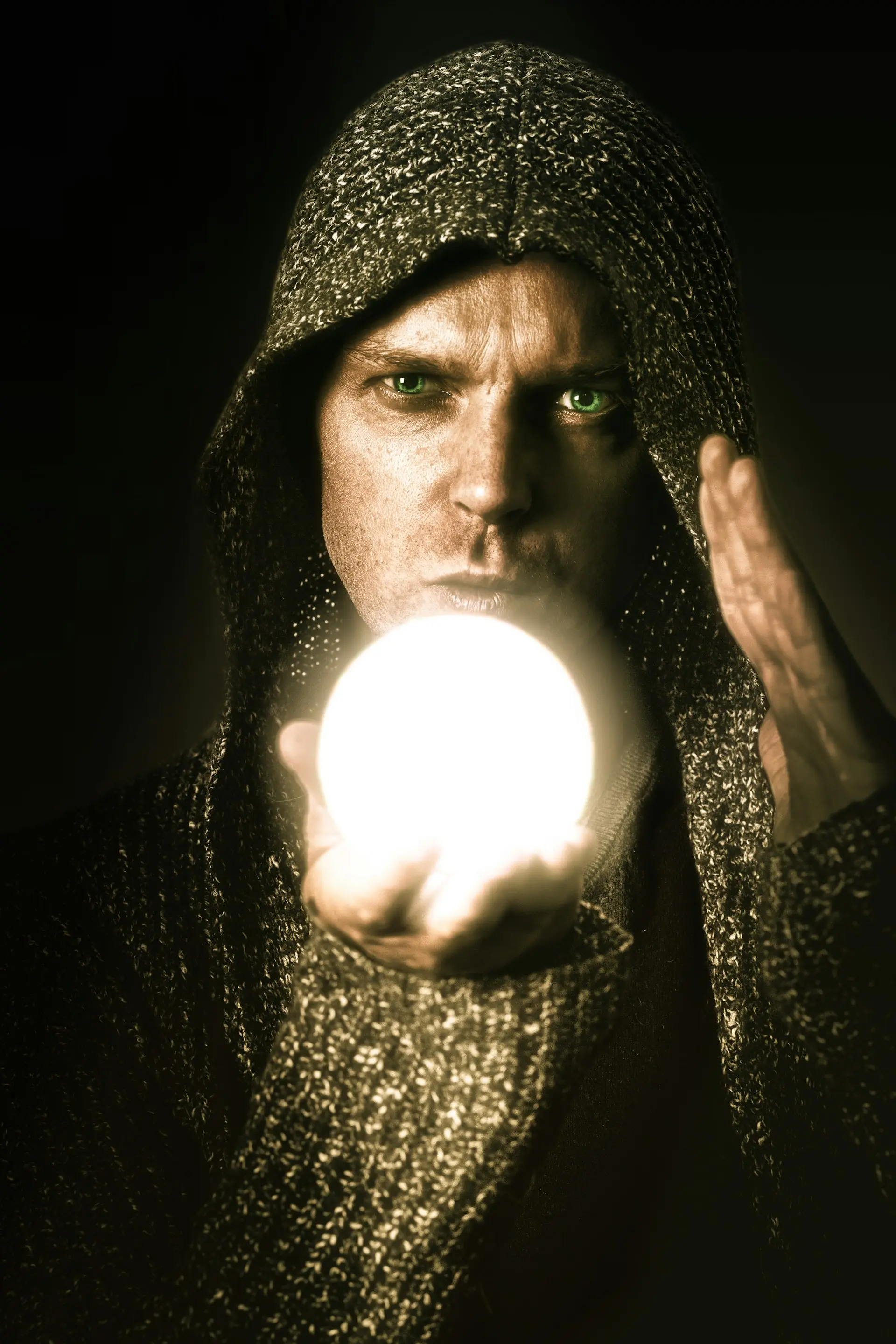 Photo by Sander Sammy on Unsplash - Man holding a light ball